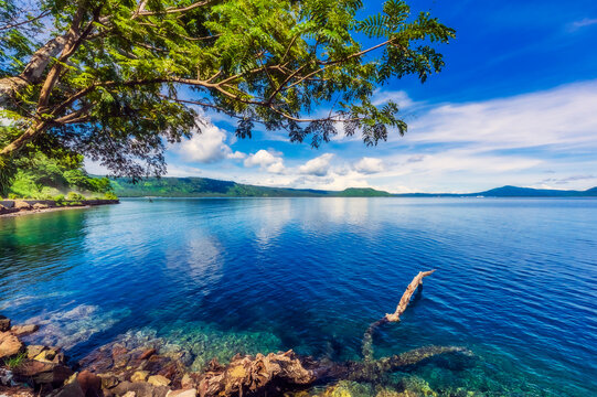 Papua New Guinea, East New Britain Province, Rabaul, Shore of New Britain island on sunny day