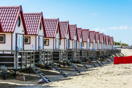 Netherlands, Zeeland, Domburg, row of wooden houses on sandy beach