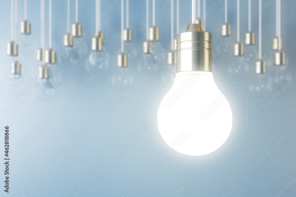 Poster glowing light bulb on blurry blue wall backdrop. idea, innovation, solution and invention concept. m