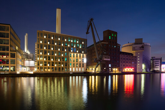 Germany, Muenster, City harbour, Flechtheimspeicher, Wolfgang Borchert Theatre and steam accumulator at night