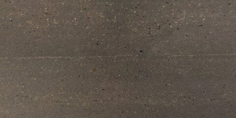 view from above on texture of old asphalt road with cracks