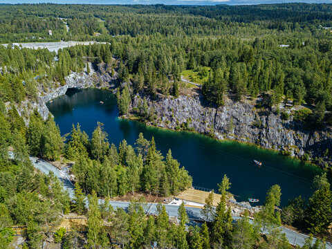 Russia, Republic of Karelia, Sortavala, Aerial view of green forest surrounding Marble Lake in summer