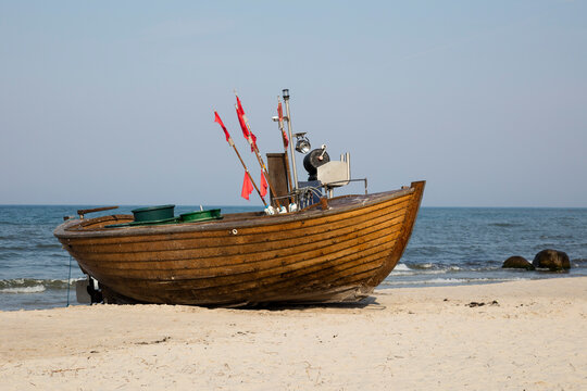 Germany, Ruegen, Binz, fishing boat at sandy beach