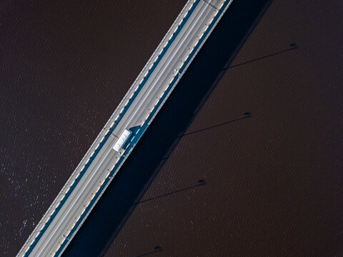 Russia, Republic of Karelia, Sortavala, Aerial view of bridge stretching across Lake Ladoga