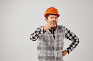 engineer in a gray vest construction work design light background