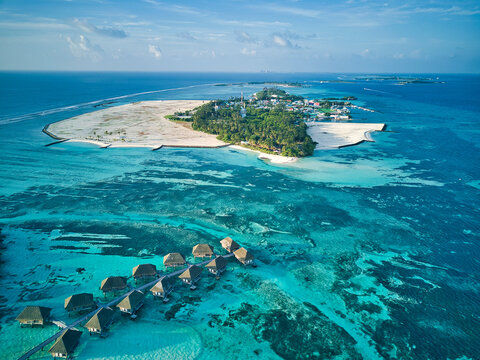 Maldives, Kaafu Atoll, Aerial view of tropical tourist resort on Huraa island