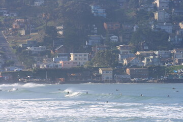 view of beach, houses and surfers at Pacifica Beach