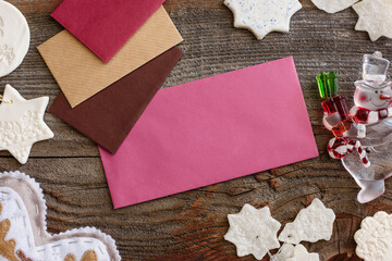 Christmas background concept. Multicolored envelopes. Christmas tree branches with cones.