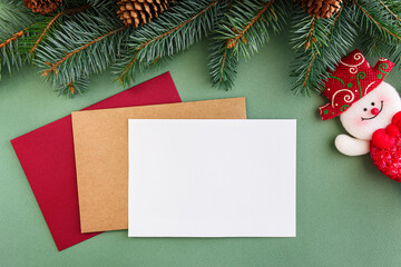 Christmas background concept. Multicolored cards. Christmas tree branches with cones.