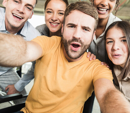 Group portrait of cheerful business people in office