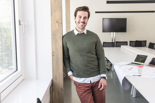 Successful, young businessman in boardroom