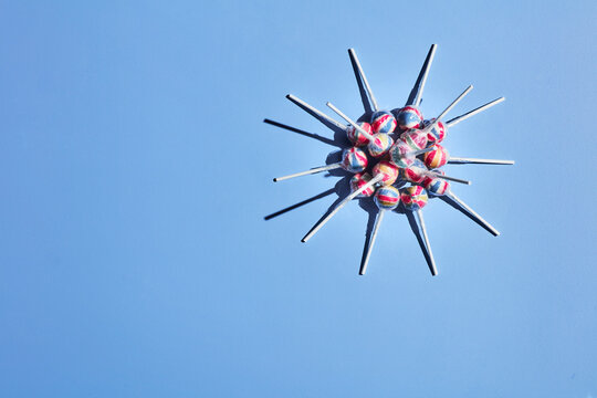 Lollipops arranged into shape of coronavirus cell