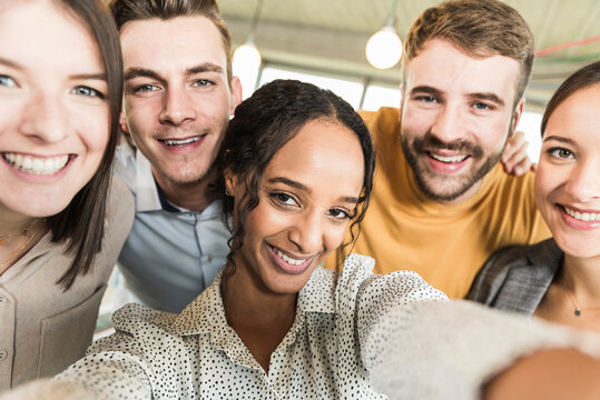 Group portrait of happy business people in office