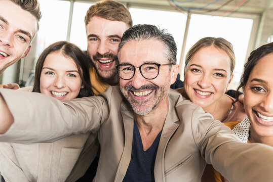 Group portrait of happy business people in office