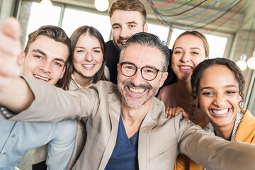 Group portrait of happy business people in office
