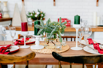 New Year's decor in red-green tones, a festive table in the New Year's interior
