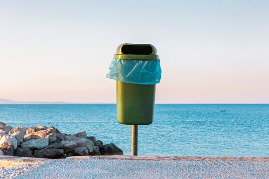 Croatia, Krk, trash bin against tranquil sea