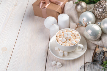 Coffee, Christmas balls and candles on a light background with space to copy.