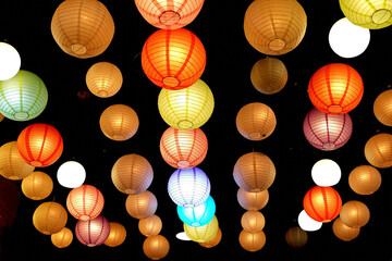 View of colorful lanterns at night.