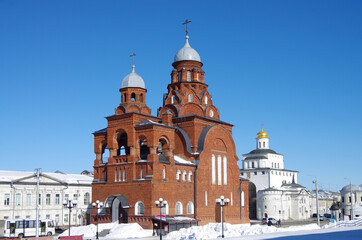 Vladimir, Russia - March, 2021: Ancient city street in winter sunny day. Trinity Church