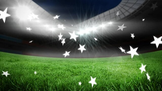 Animation of stars floating over sports stadium at night