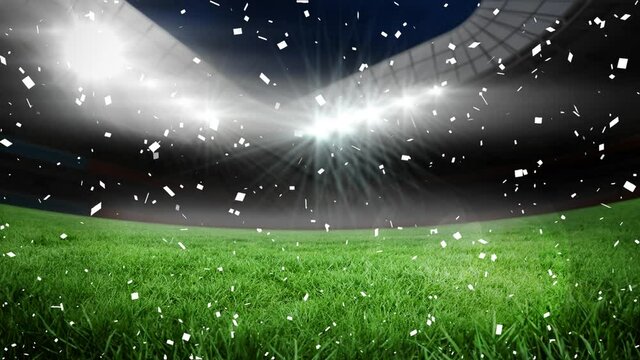 Animation of confetti floating over sports stadium at night