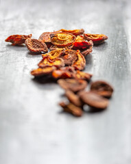 Dried apricots on rustic dark background