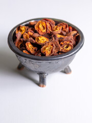 Dried apricots in rustic dark plate
