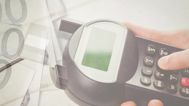 Animation of euro banknotes falling over hand of caucasian man holding payment terminal