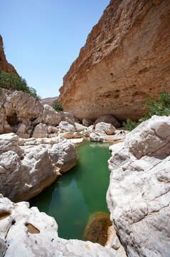 Tourist looking at Wadi Bani Khalid, Oman