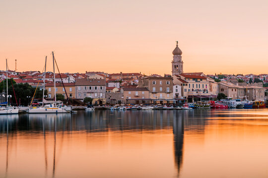 Croatia, Krk, cityscape and marina at sunset