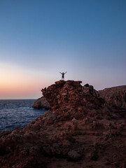 Person in a rock in blue hour