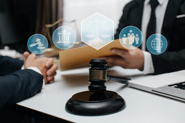 Concepts of Law and Legal services. Lawyer working with law interface icons. Blurred background.	