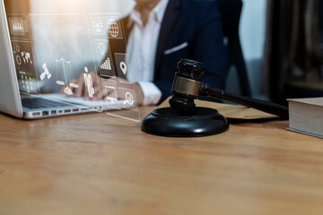 Concepts of Law and Legal services. Lawyer working with law interface icons. Blurred background.	