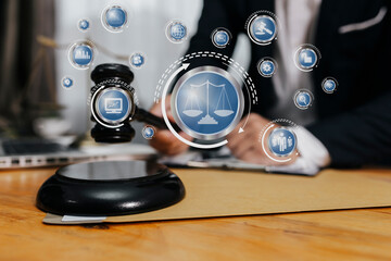 Concepts of Law and Legal services. Lawyer working with law interface icons. Blurred background.