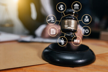 Concepts of Law and Legal services. Lawyer working with law interface icons. Blurred background.	