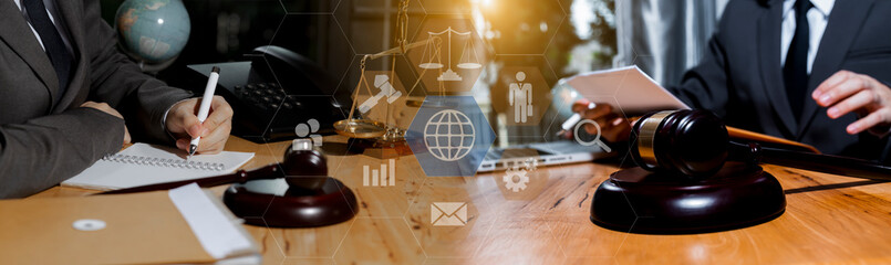 Concepts of Law and Legal services. Lawyer working with law interface icons. Blurred background.