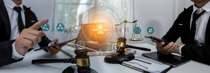 Concepts of Law and Legal services. Lawyer working with law interface icons. Blurred background.