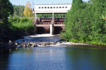 Girvas, Russia - July, 2021: Dam and waterfall on the Suna river
