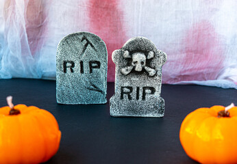 graves and pumpkins on black background for halloween night