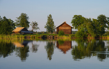 Fototapeta premium Kizhi, Karelia, Russia - July, 2021: Traditional northern wooden houses on the territory of the Kizhi Museum