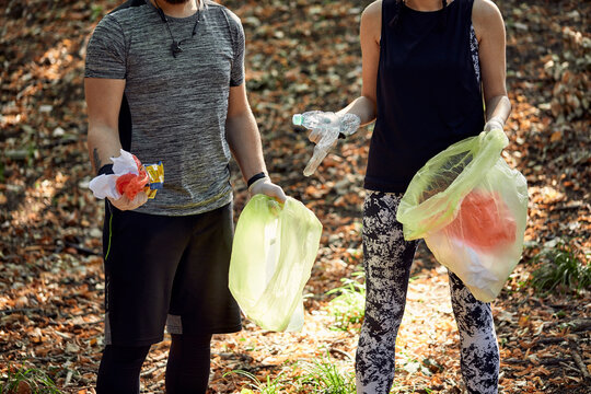 Couple plogging in forest