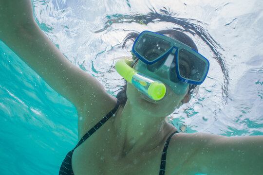 Portrait of woman snorkeling under water