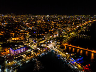 Aerial view of night marina port with yachts