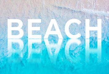 The word BEACH written by the ocean with a wave on the beach. Background for advertising