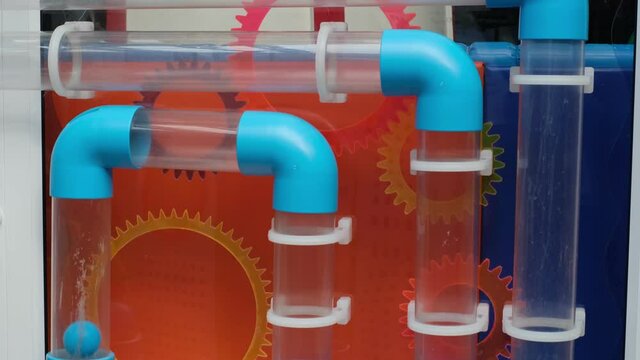 fascinating physics with a labyrinth of pipes. By doing the experiments. Ball fly with rolls through the pipe.