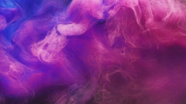 Paint water drop. Color fluid mix. Logo opener. Underwater splash animation. Vibrant neon pink blue glitter vapor cloud blend motion on dark abstract background for intro.