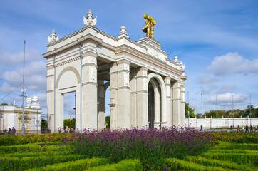 Fototapeta na wymiar Moscow, Russia - September, 2021: Arch of the main entrance of VDNKh on a sunny autumn day