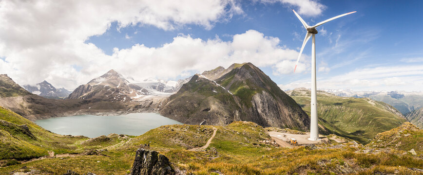 Wind turbine by Griessee lake with Gries glacier in background at Nufenen Pass, Valais, Switzerland