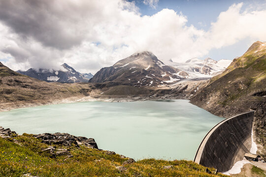 Beautiful landscape scenery of Griessee lake with Gries glacier in background at Nufenen Pass, Valais, Switzerland